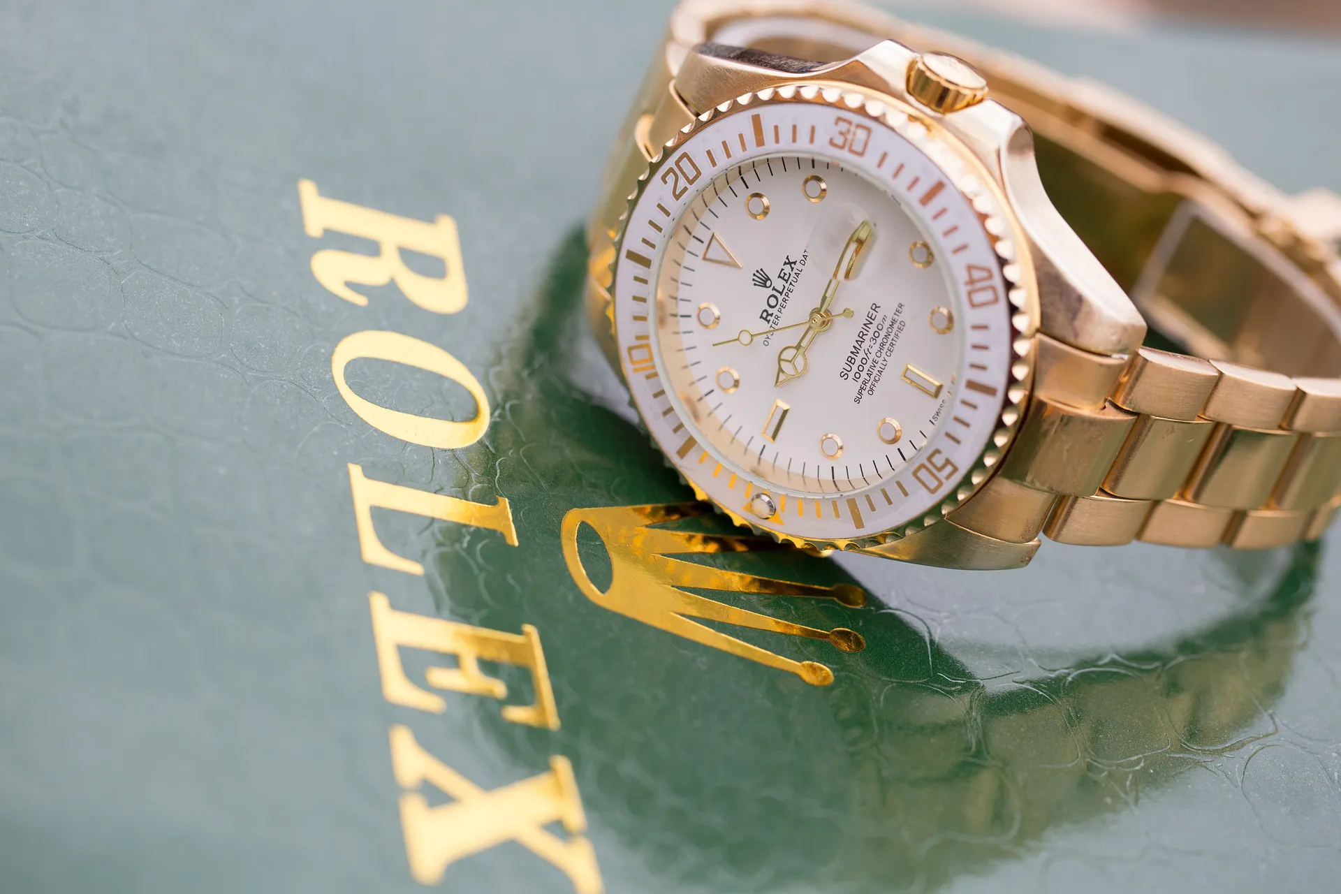 Rolex watch next to the word Rolex