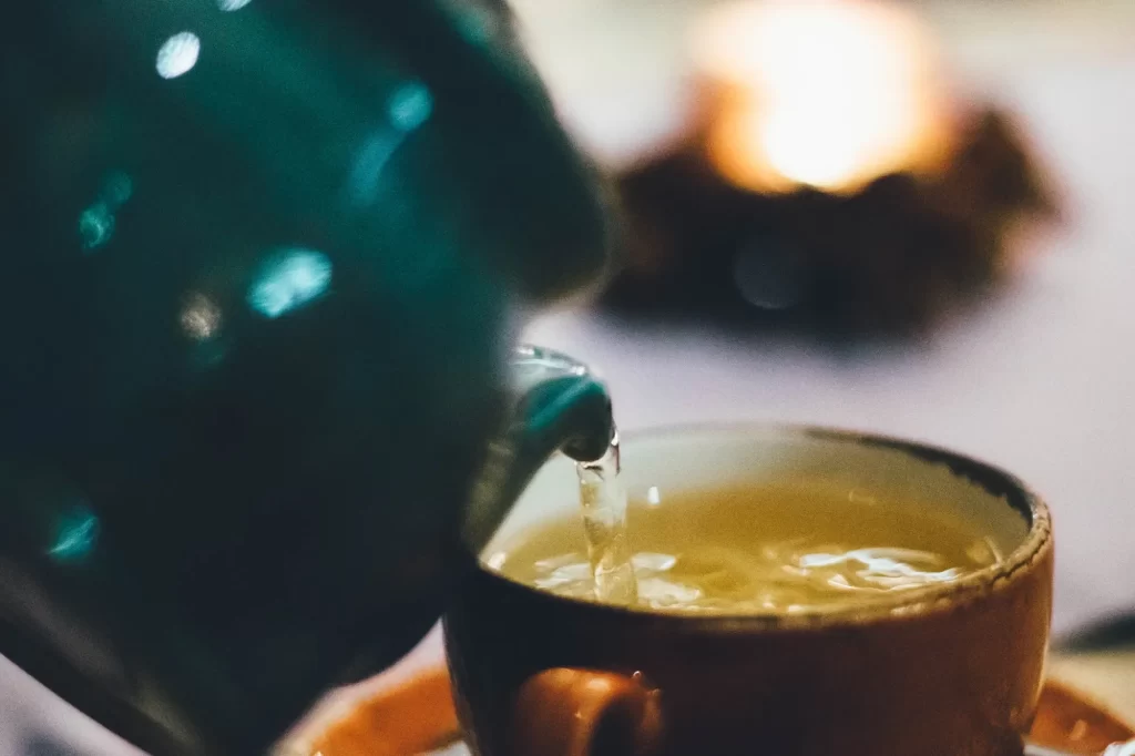 Green Tea pouring into a cup