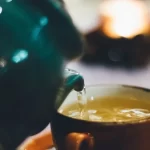 Green Tea pouring into a cup